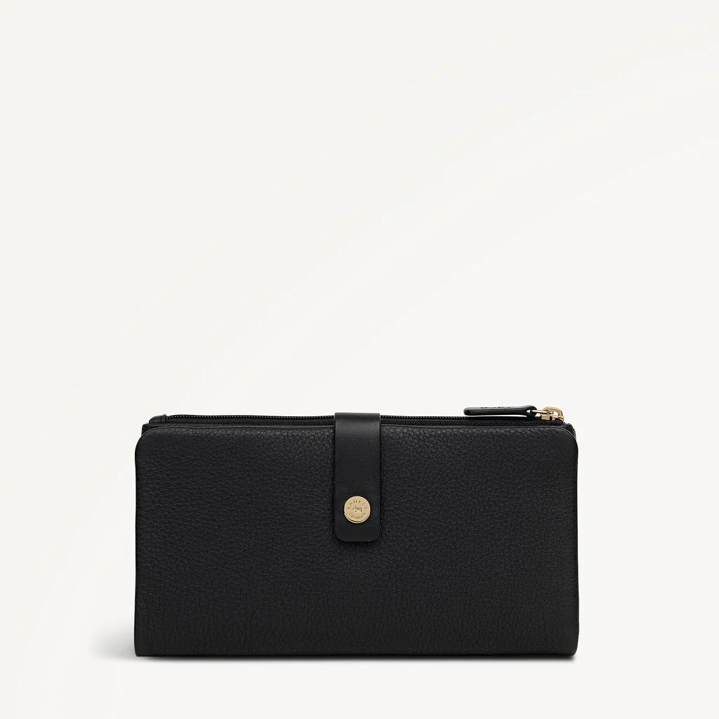 Black wallet with gold zipper on a light gray background