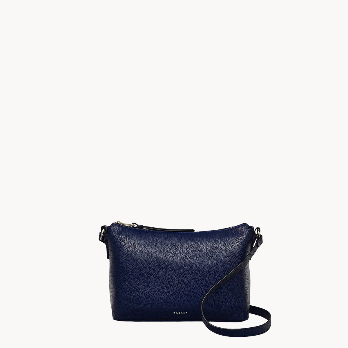 Navy blue handbag with a strap on a white background