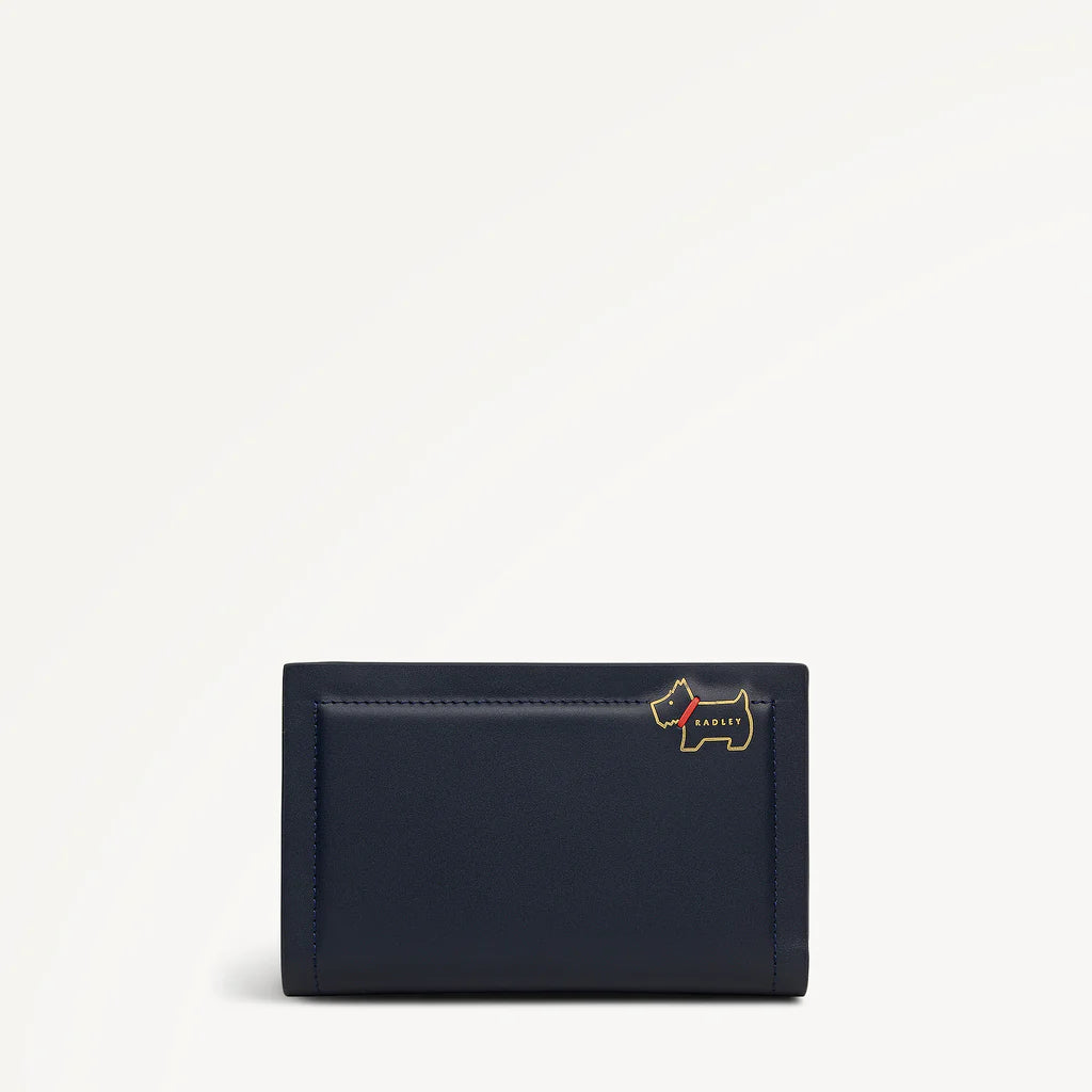 Navy blue wallet with a small dog emblem on a light gray background