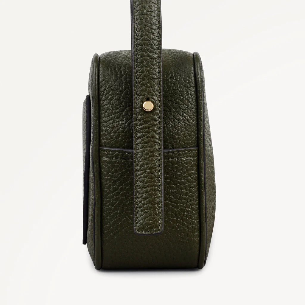 Green leather handbag with a strap on a white background