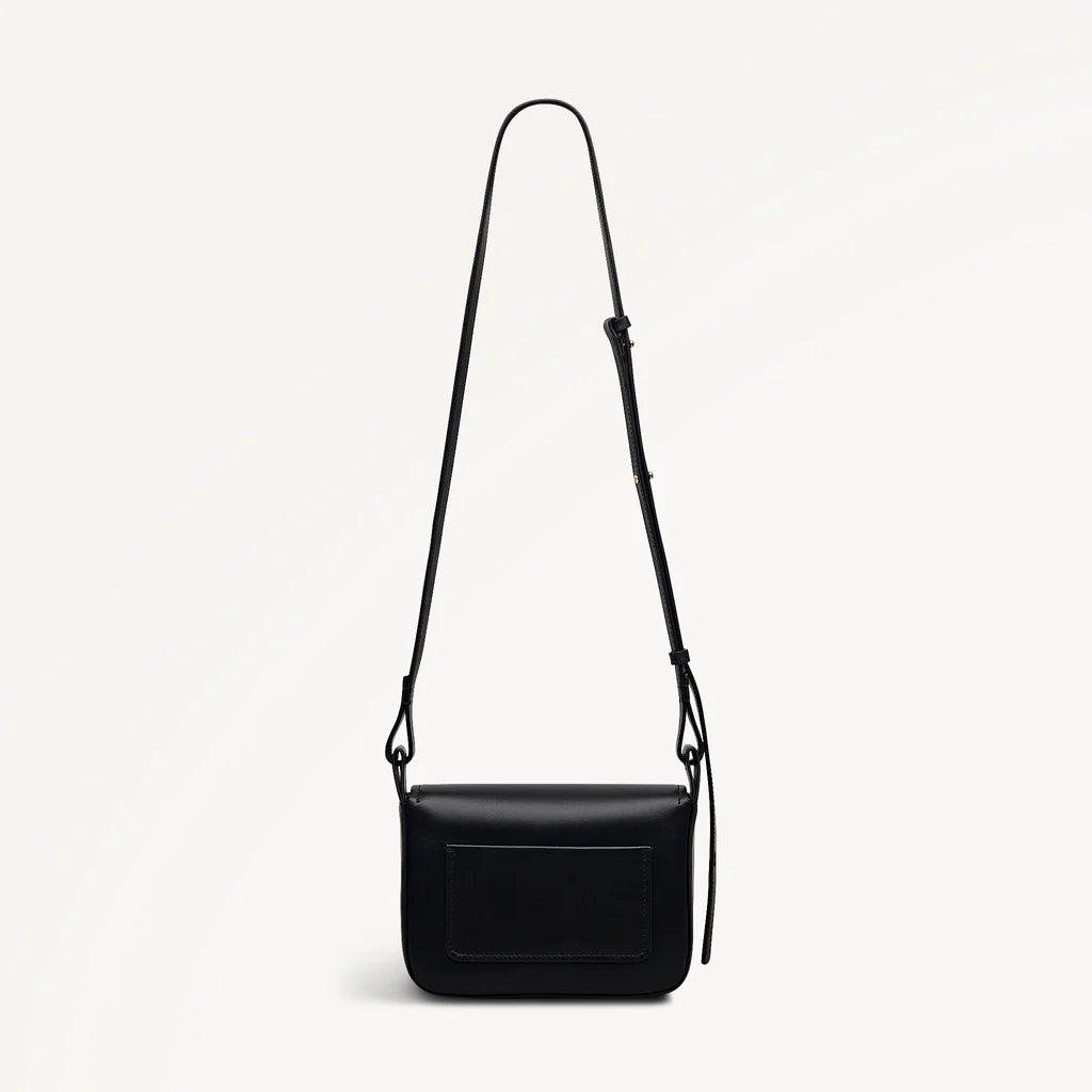 Black leather crossbody bag on a light gray background