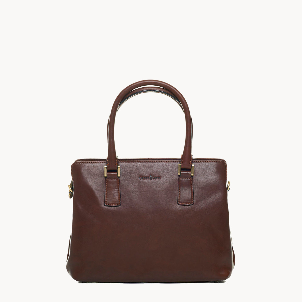 Brown leather handbag with gold accents on a white background