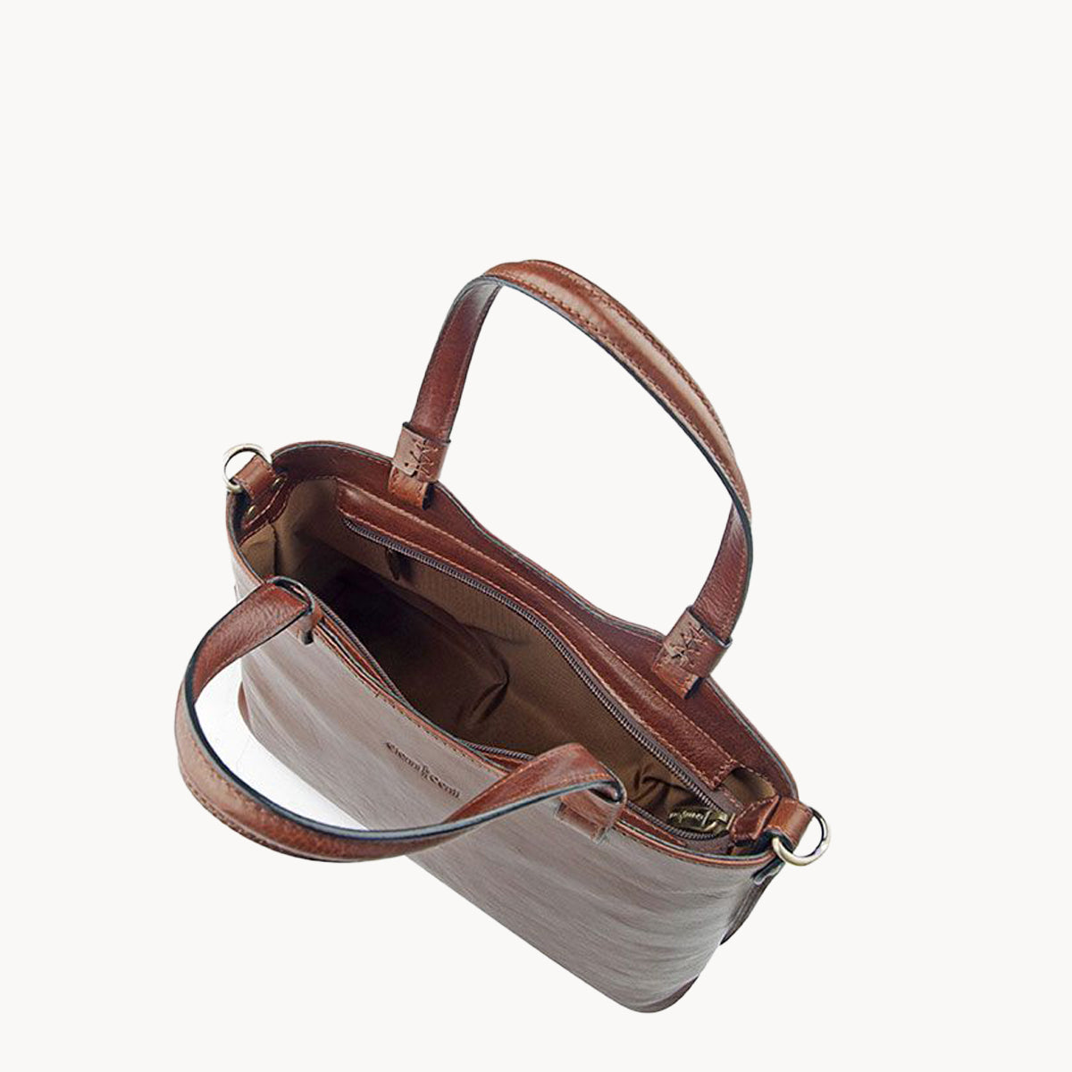 Brown leather handbag with gold hardware on a white background