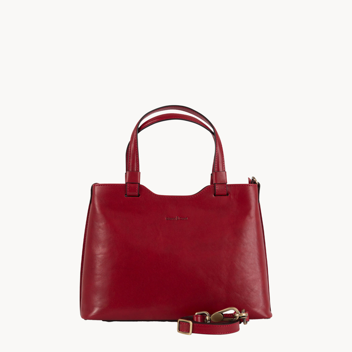 Red handbag with a strap on a white background