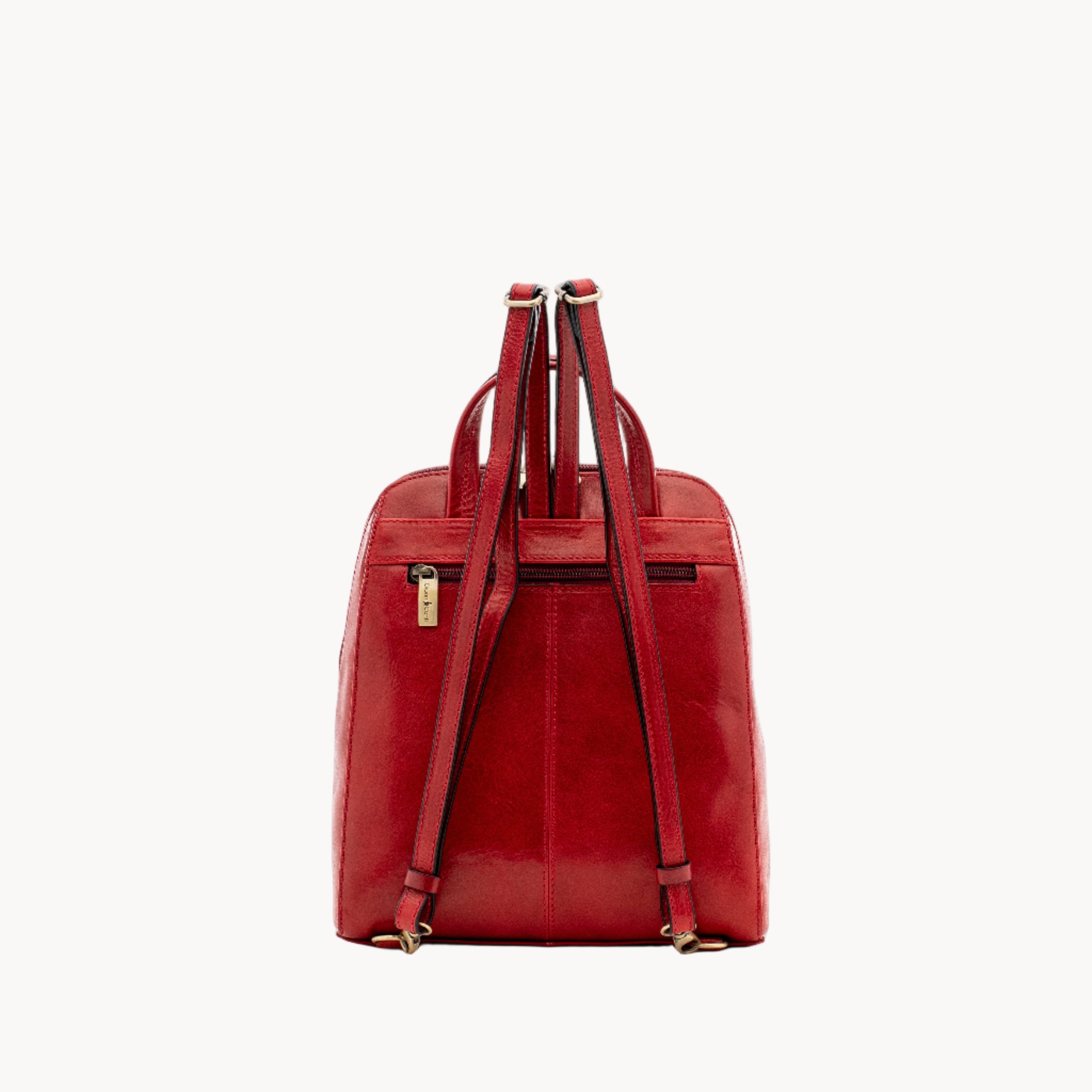 Red leather backpack on a white background