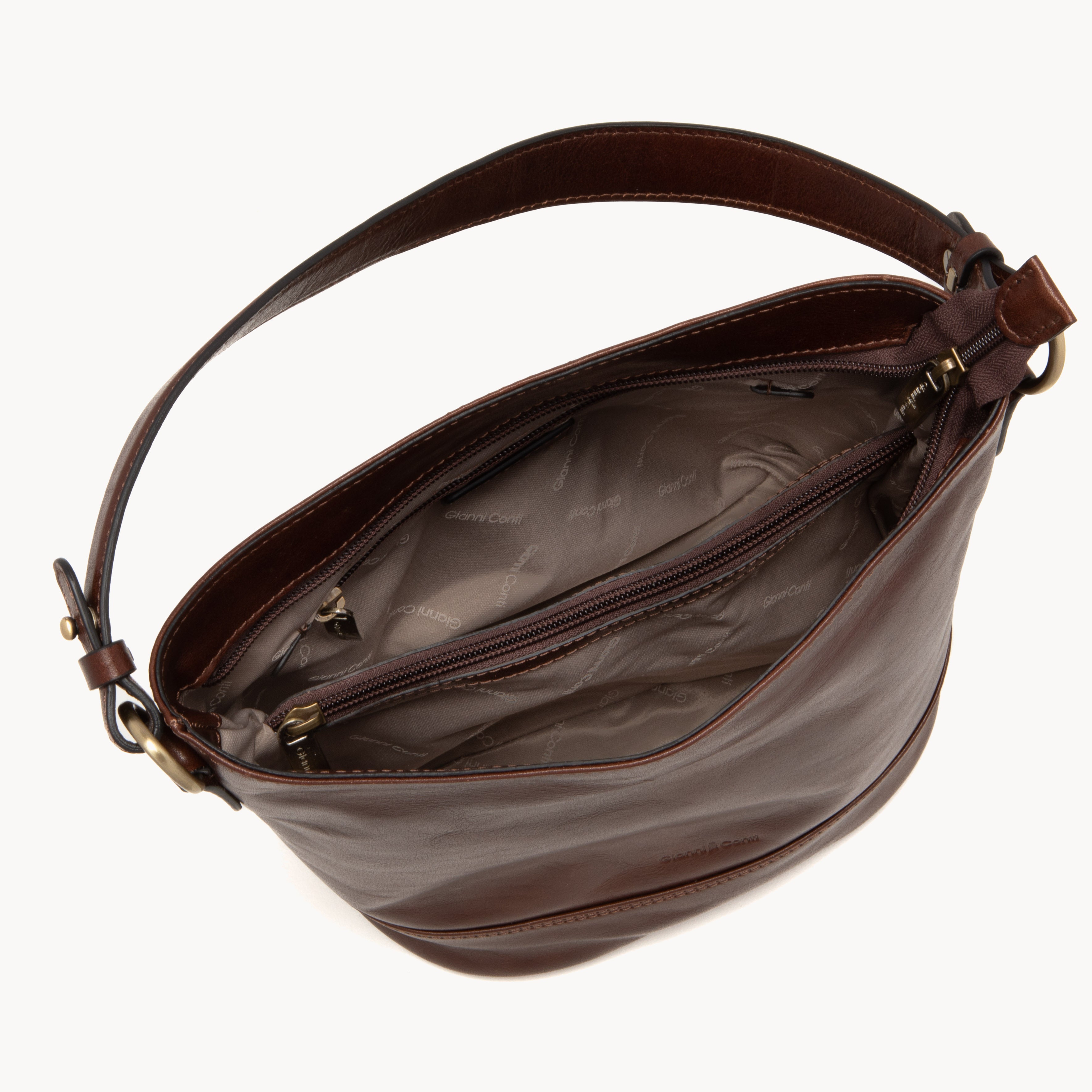 Brown leather handbag with a visible brand logo on a white background