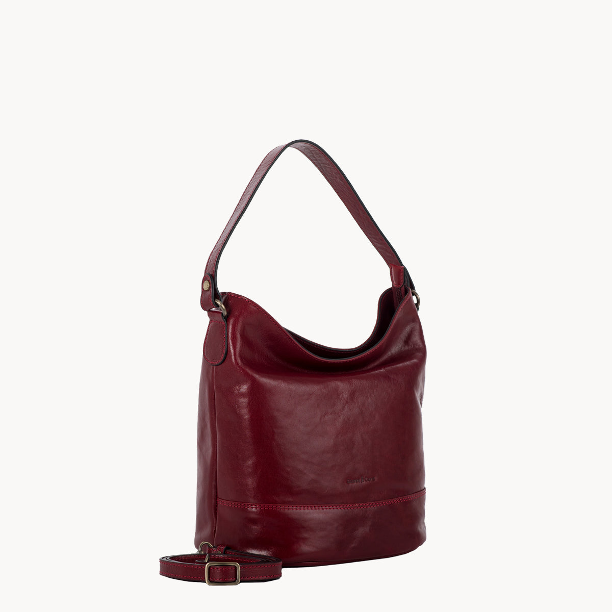 Red leather handbag on a white background