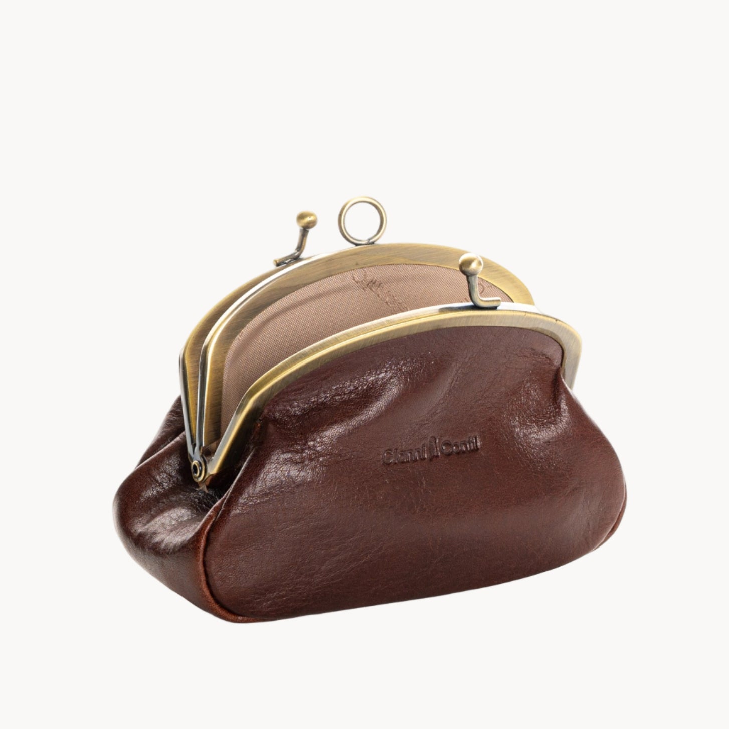 Brown leather coin purses with gold clasp on a white background
