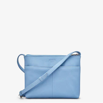 Blue handbag with a strap on a white background
