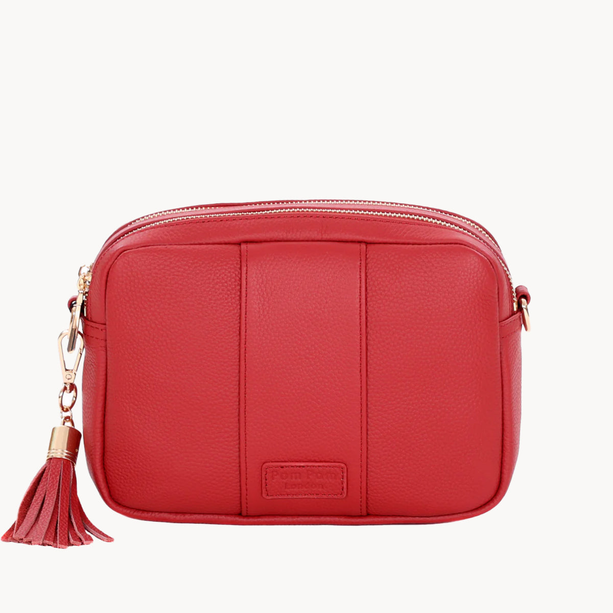 Red handbag with a tassel on a white background
