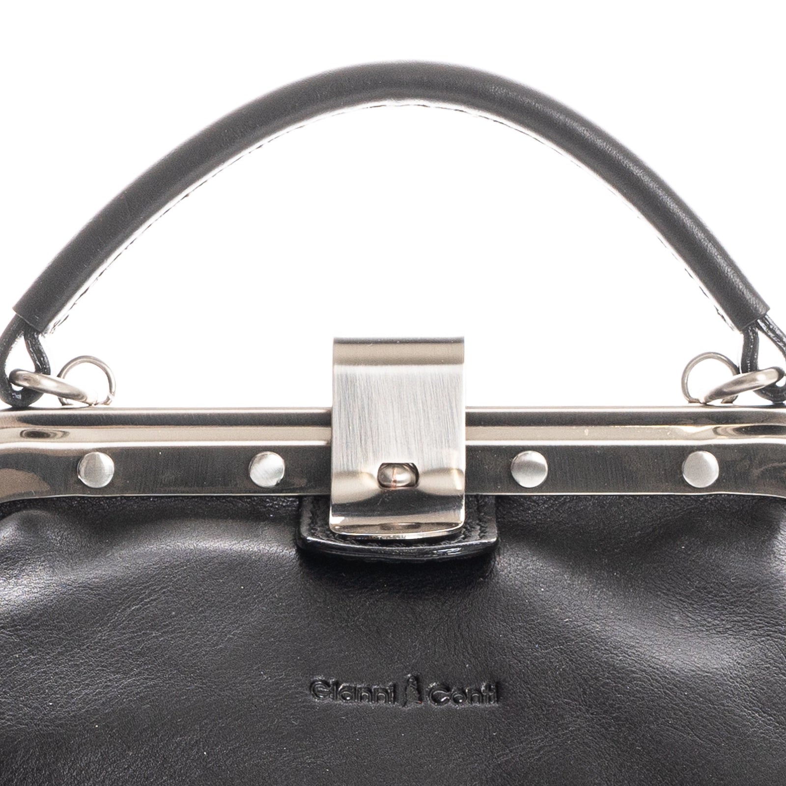 Close-up of black Italian leather handbag clasp detail