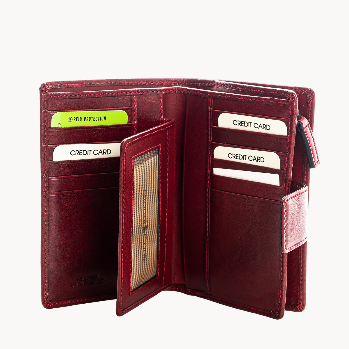 Open red leather wallet with card slots on a white background