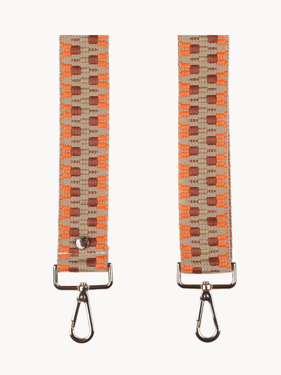 Two woven straps with metal carabiners on a white background