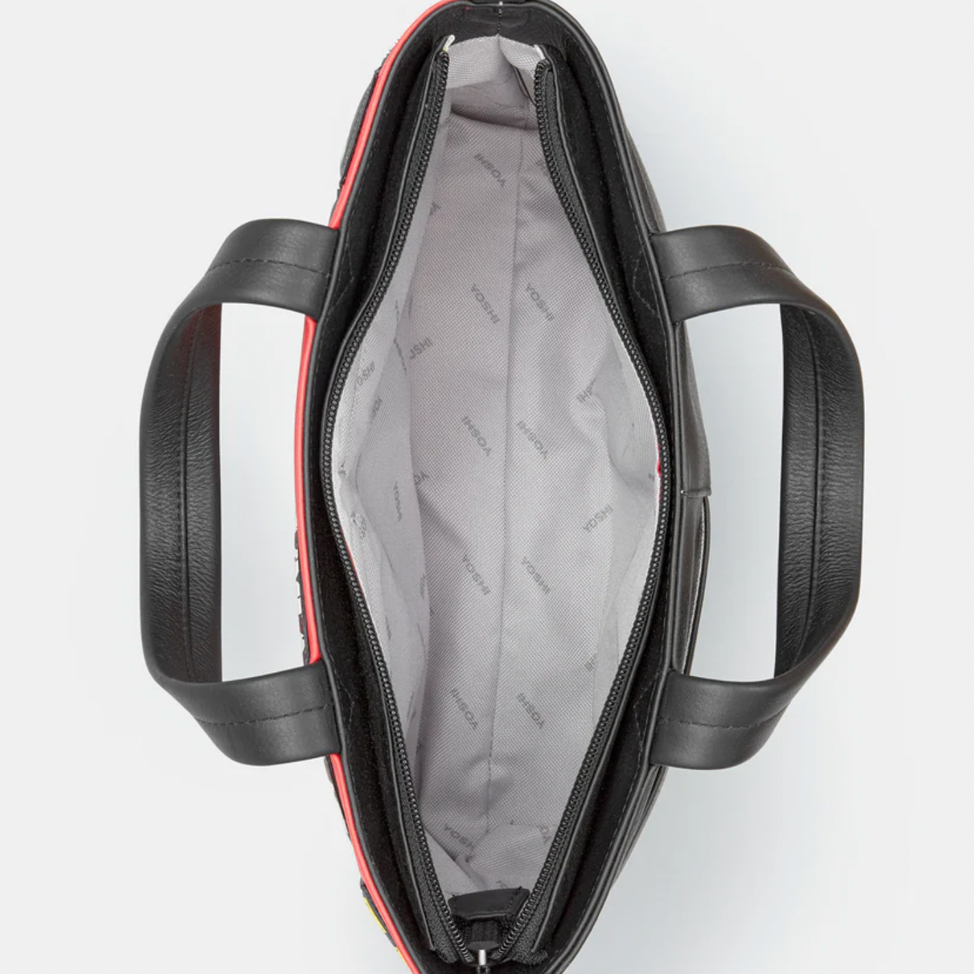 Inside Black leather handbag with red accents on a white background