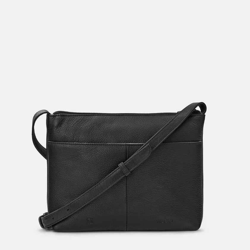 Black leather crossbody bag on a light gray background