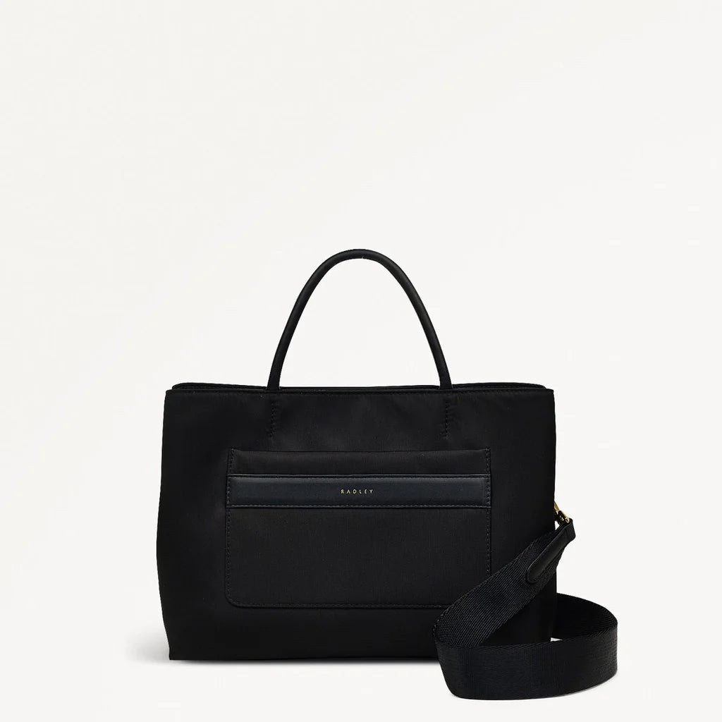 Black handbag with a shoulder strap on a white background