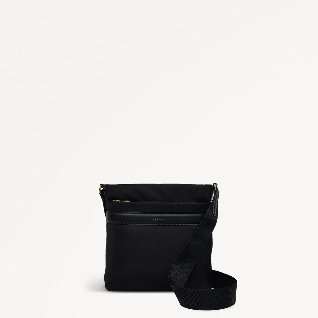 Black crossbody bag with a strap on a white background