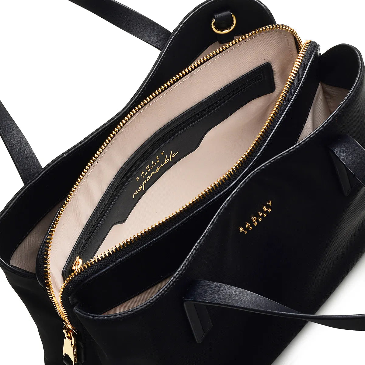 Black handbag with gold zipper and visible brand name on a white background