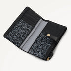 Black wallet with gold zipper on a light gray background