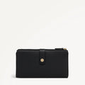 Black wallet with gold zipper on a light gray background