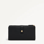 Black wallet with gold zipper on a light gray background