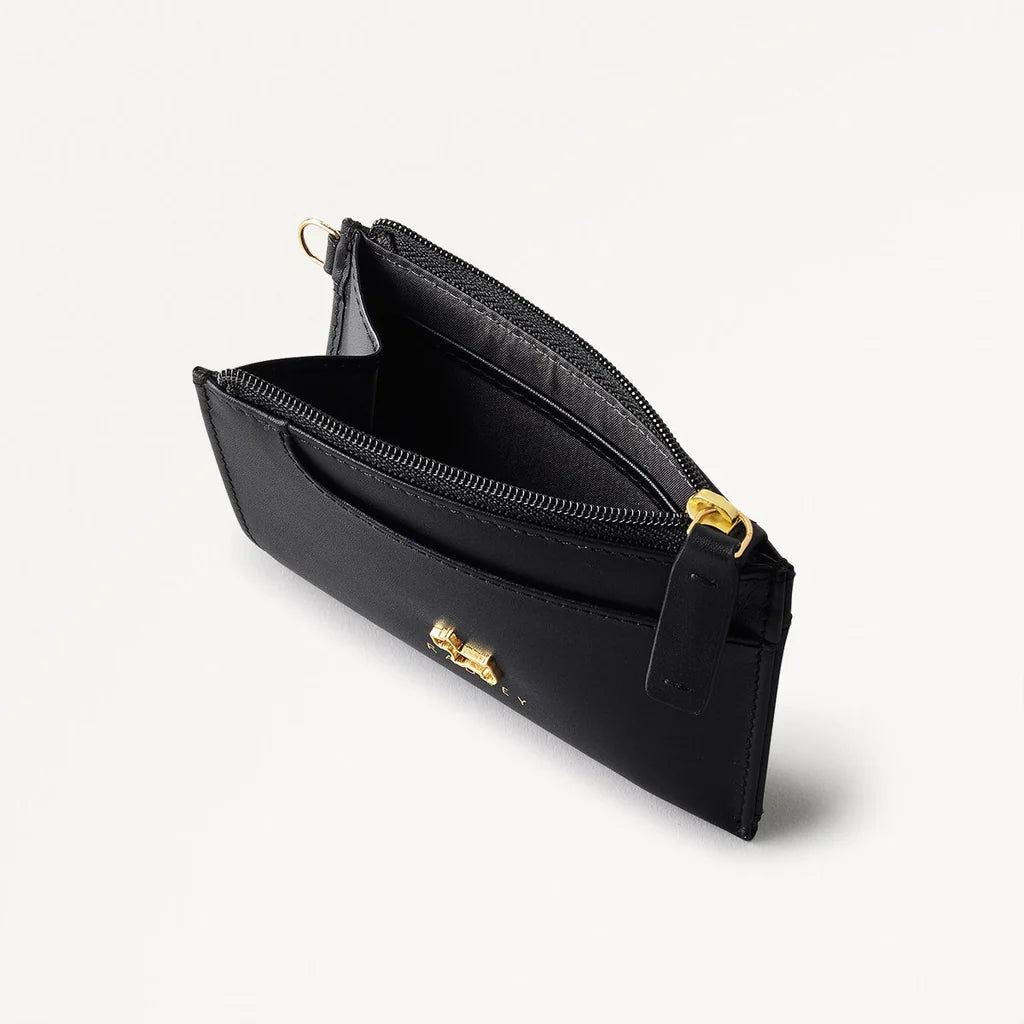 Black wallet with gold zipper pull on a white background