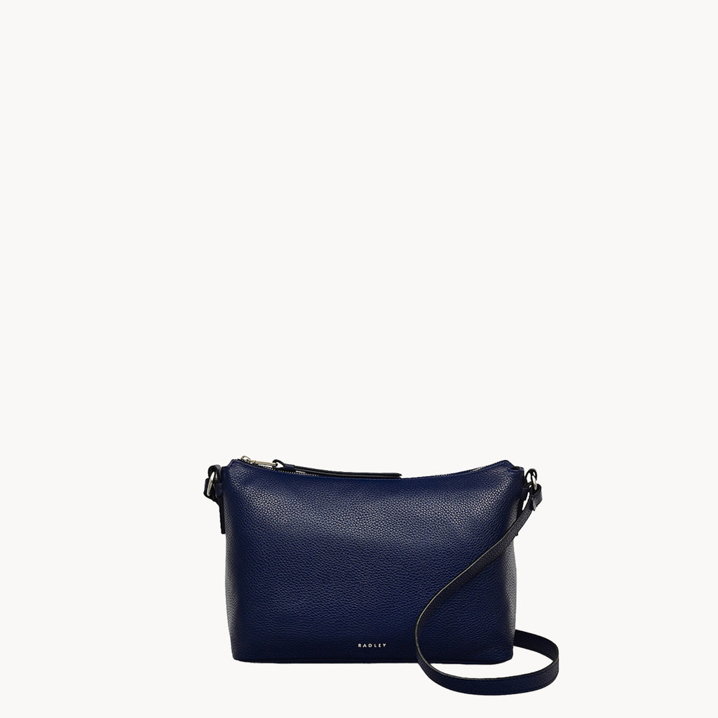 Navy blue handbag with a strap on a white background