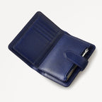 Blue leather wallet with a zipper on a light gray background