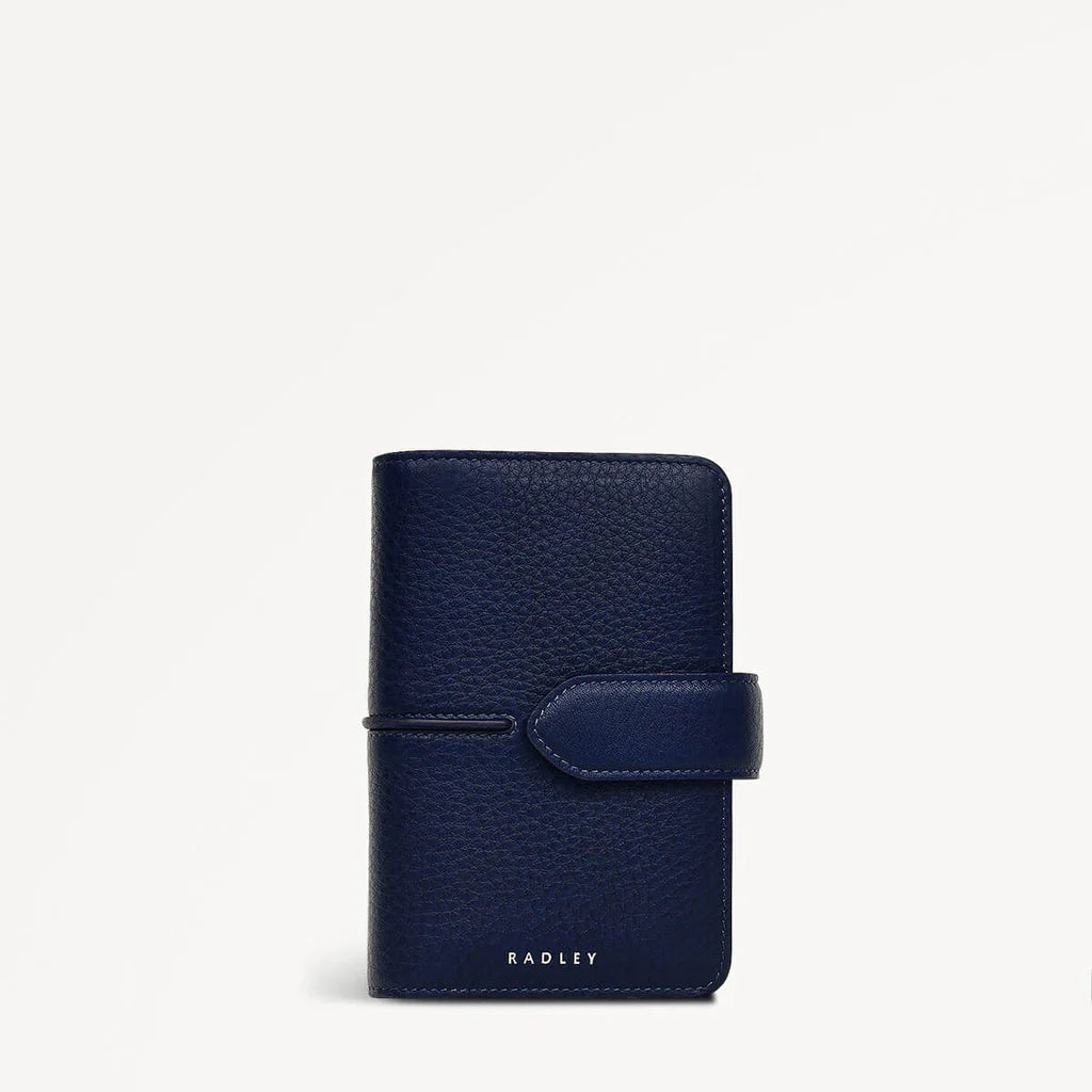 Navy leather planner with a strap on a white background