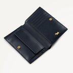 Blue leather wallet with gold accents on a white background