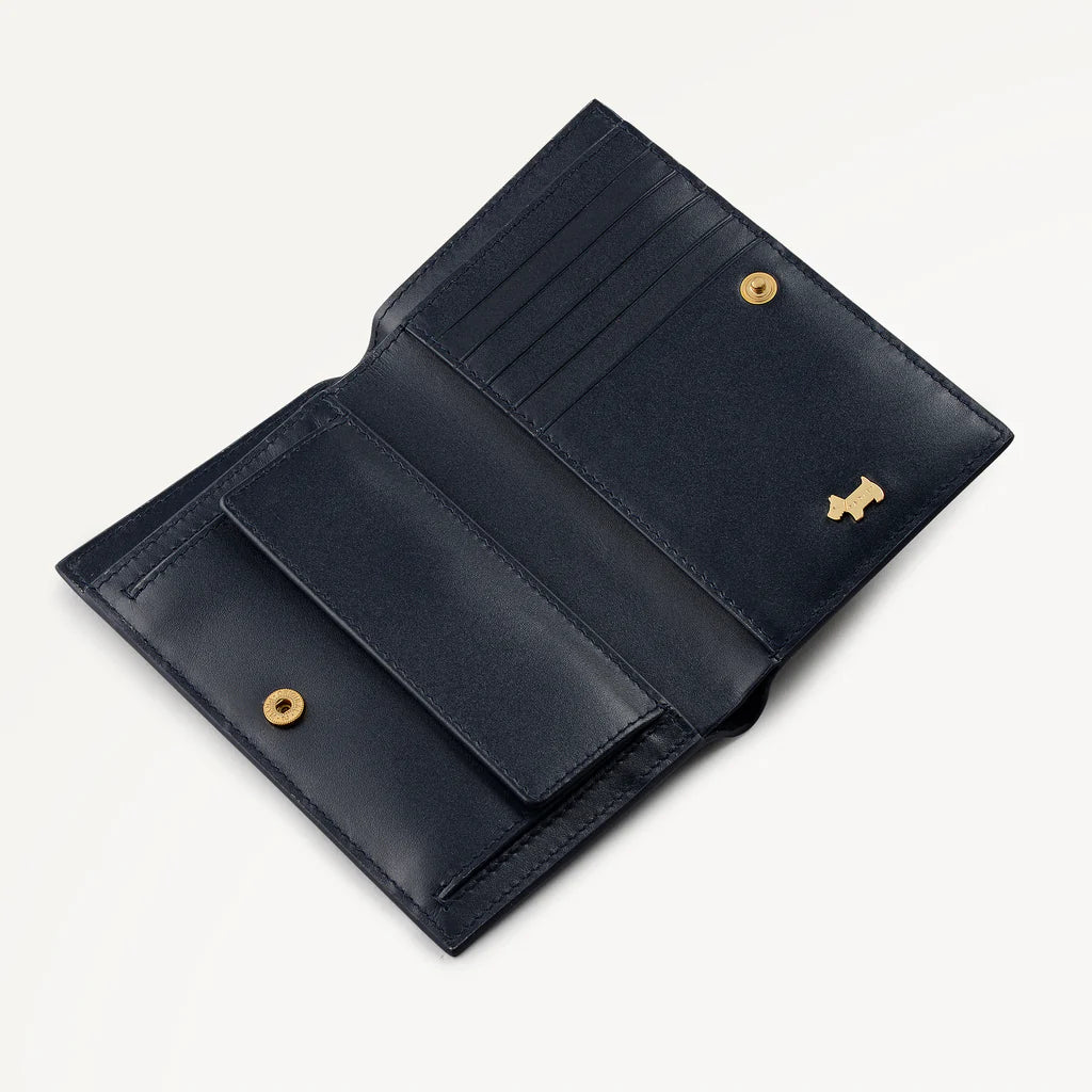 Blue leather wallet with gold accents on a white background