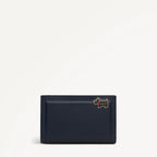 Navy blue wallet with a small dog emblem on a light gray background