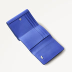 Blue wallet with a brand logo on a white background
