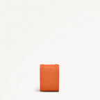 Orange leather wallet on a white background