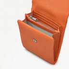 Orange wallet with a zipper on a white background