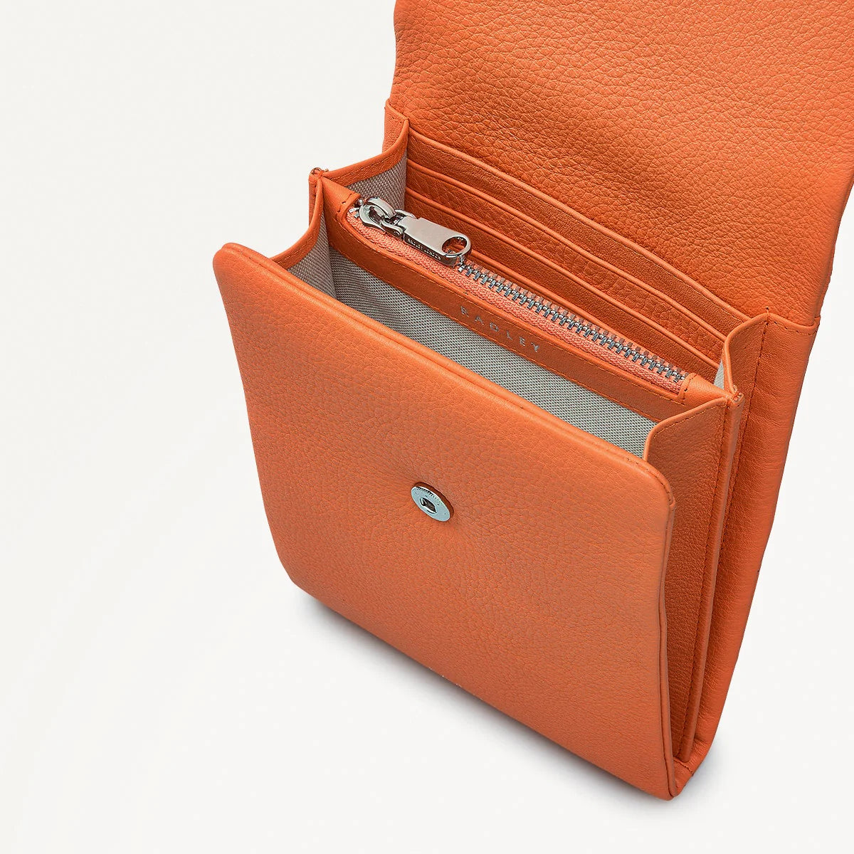 Orange wallet with a zipper on a white background