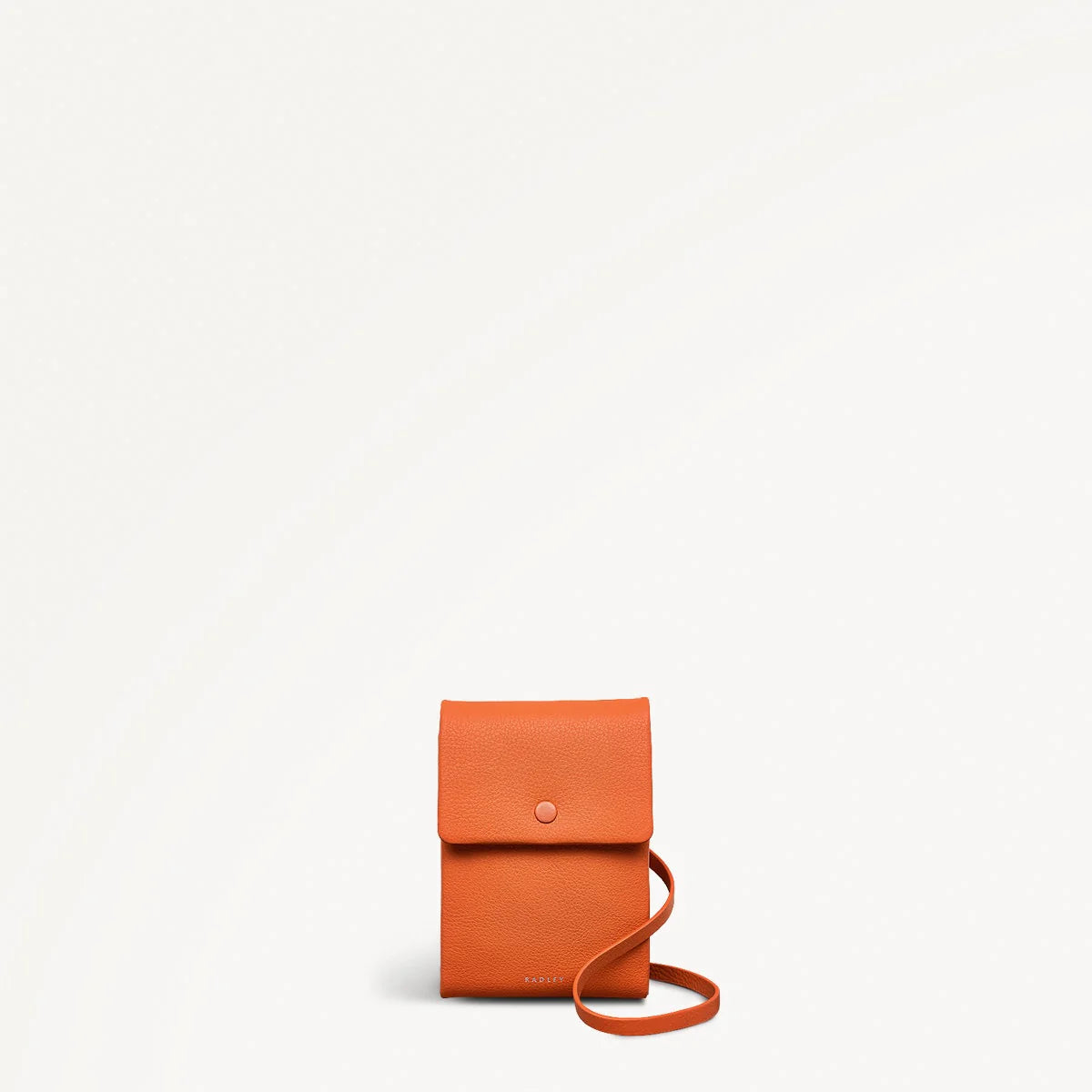 Orange leather crossbody bag on a white background