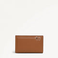 Brown leather wallet with a small logo on a white background