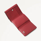 Red leather wallet on a light gray background