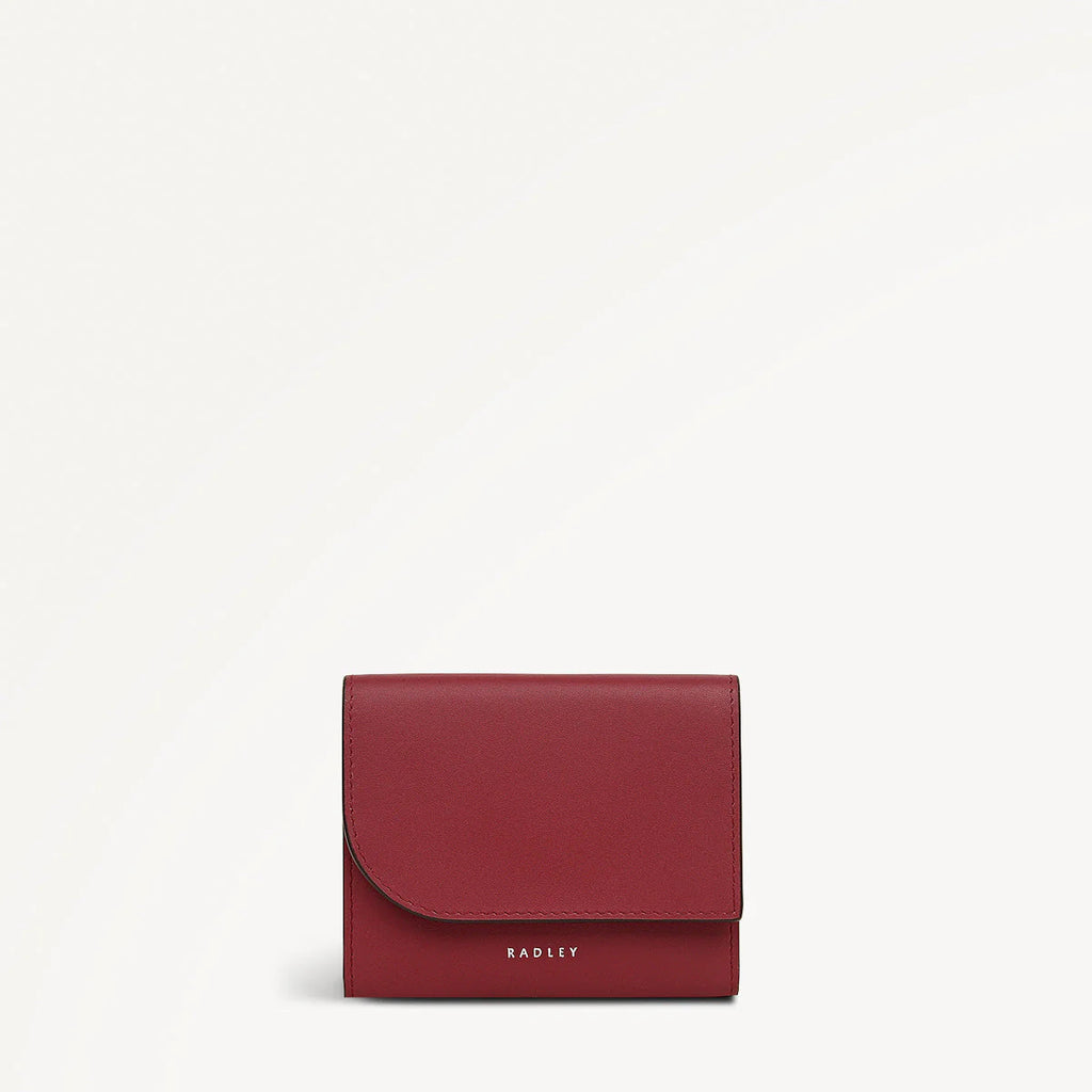 Red wallet with 'Radley' branding on a white background