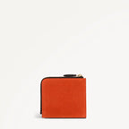 Orange wallet with a zipper on a white background