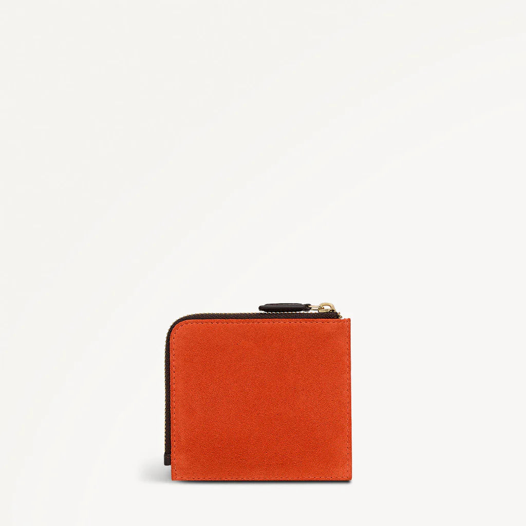 Orange wallet with a zipper on a white background