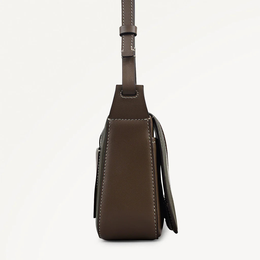 Brown leather crossbody bag on a light gray background