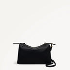 Black handbag on a light gray background
