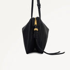 Black leather handbag with a gold zipper on a white background