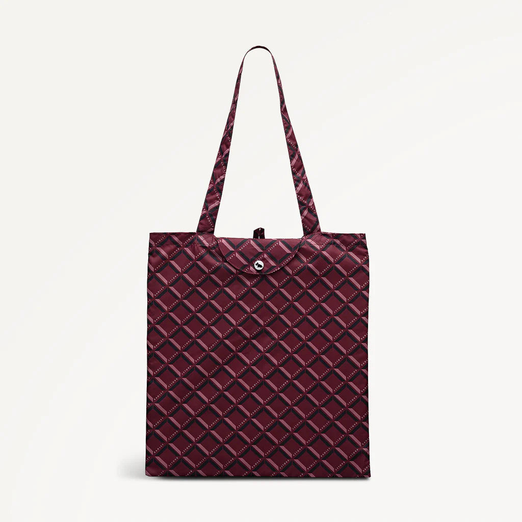 Maroon foldaway shopper  with Radley geometric monogram print on a light gray background