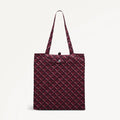 Maroon foldaway shopper  with Radley geometric monogram print on a light gray background