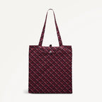 Maroon foldaway shopper  with Radley geometric monogram print on a light gray background
