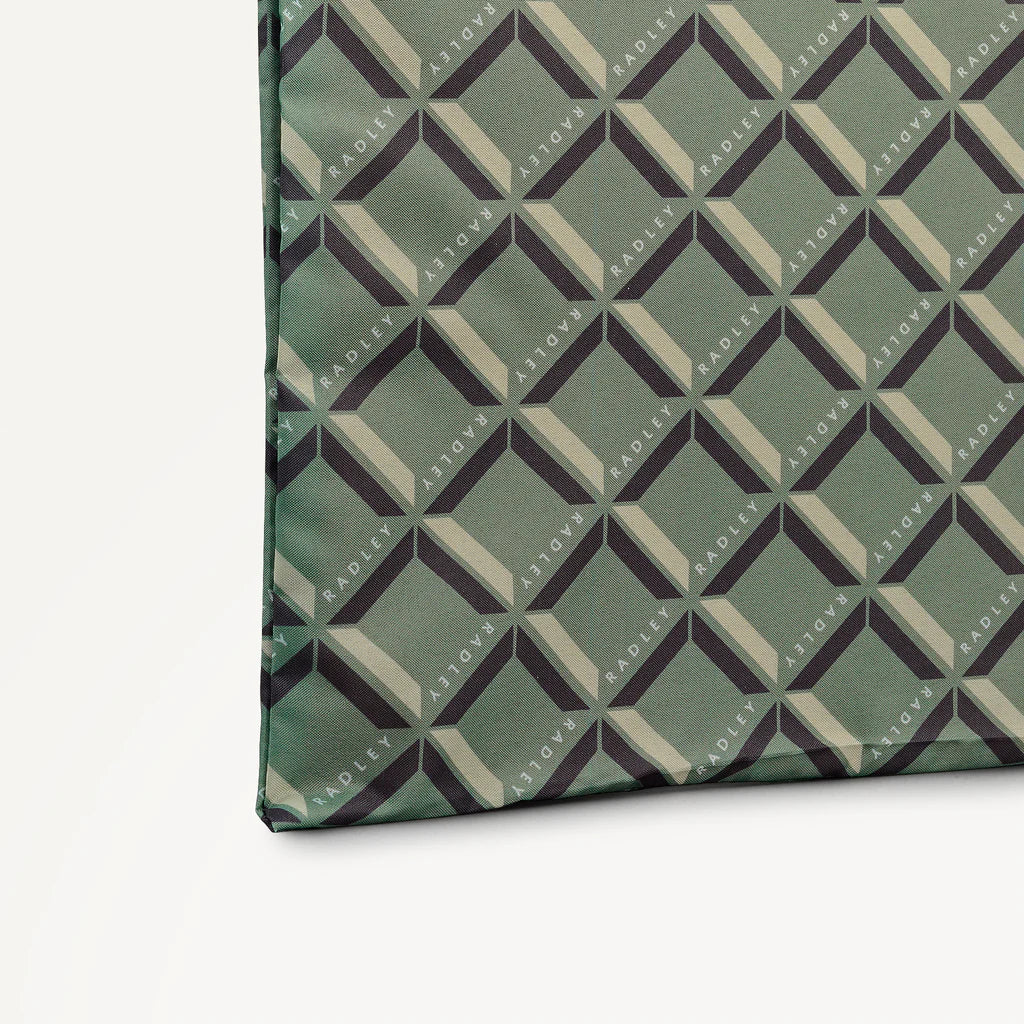 Green foldaway shopper  with Radley geometric monogram print on a light gray background