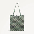 Green foldaway shopper  with Radley geometric monogram print on a light gray background